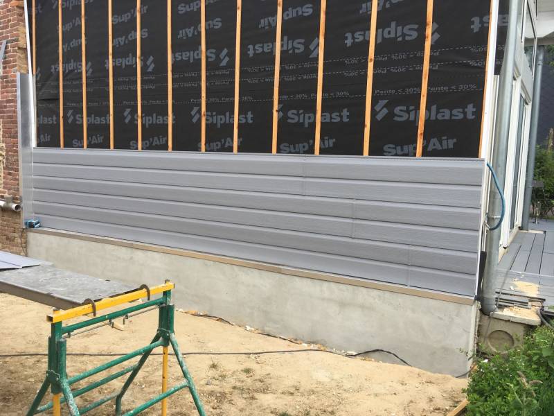 Travaux d'isolation d'un mur mitoyen avec la pose de clin PVC secteur Valmont proche Bolbec